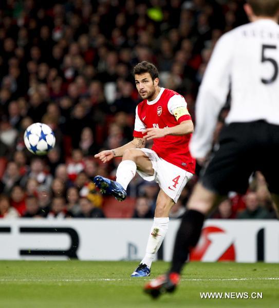 Arsenal's Cesc Fabregas passes the ball during a group H match against Shakhtar Donetsk at the 2010-2011 UEFA Champions League at the Emirates Stadium in London, England, Oct. 19, 2010. Arsenal won 5-1. (Xinhua/Tang Shi)