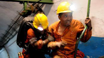 Rescuers return from underground at the coal mine in Yuzhou City, central China's Henan Province, Oct. 16, 2010.