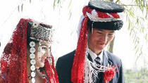 Brides and grooms attend a group wedding ceremony in Zepu, northwest China's Xinjiang Uygur Autonomous Region, Oct. 19, 2010.