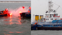 China Coast Guard vessels take part in a maritime search and rescue drill on the Bohai Sea of Tianjin South Port area on October 19, 2010 in Tianjin, China.