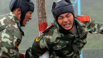 Two armed policemen compete in a military training competition held in Xi'an, capital of Shaanxi, Oct. 19, 2010.