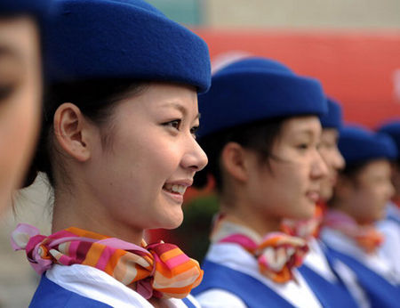 Eleven students from Zhongyuan University of Technology in Zhengzhou, the capital of Central China's Henan Province, leave for Guangzhou, Guangdong province on October 19, 2010, to rehearse for the upcoming 16th Asian Games. They are among the 380 ceremonial volunteers called 'Asian Games Angels' selected by the Guangzhou Asian Games Organising Committee. 