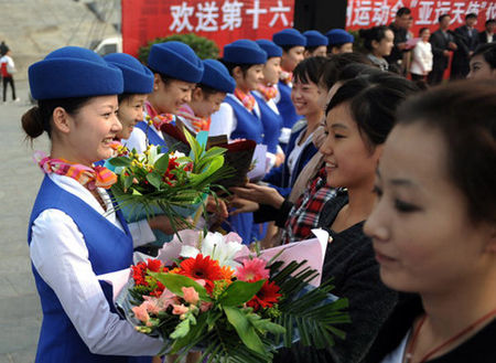 Eleven students from Zhongyuan University of Technology in Zhengzhou, the capital of Central China's Henan Province, leave for Guangzhou, Guangdong province, on October 19, 2010, to rehearse for the upcoming 16th Asian Games. 