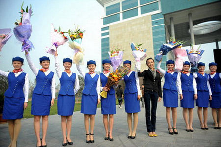 Eleven students from Zhongyuan University of Technology in Zhengzhou, the capital of Central China's Henan Province, leave for Guangzhou, Guangdong province, on October 19, 2010, to rehearse for the upcoming 16th Asian Games. 