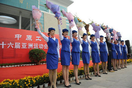 Eleven students from Zhongyuan University of Technology in Zhengzhou, the capital of Central China's Henan Province, leave for Guangzhou, Guangdong province, on October 19, 2010, to rehearse for the upcoming 16th Asian Games. 