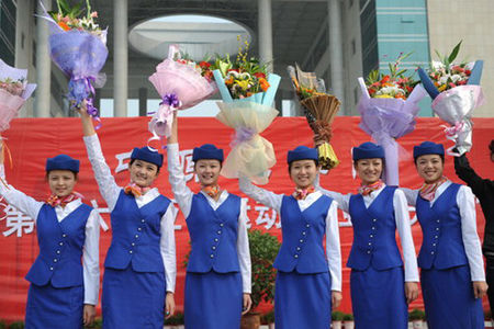 Eleven students from Zhongyuan University of Technology in Zhengzhou, the capital of Central China's Henan Province, leave for Guangzhou, Guangdong province, on October 19, 2010, to rehearse for the upcoming 16th Asian Games. 