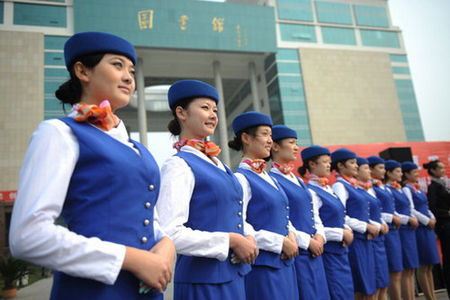 Eleven students from Zhongyuan University of Technology in Zhengzhou, the capital of Central China's Henan Province, leave for Guangzhou, Guangdong province, on October 19, 2010, to rehearse for the upcoming 16th Asian Games. 