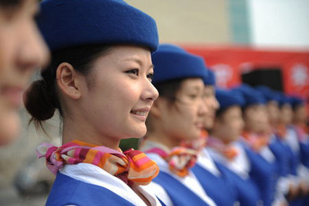 Eleven students from Zhongyuan University of Technology in Zhengzhou, the capital of Central China's Henan Province, leave for Guangzhou, Guangdong province, on October 19, 2010, to rehearse for the upcoming 16th Asian Games. 