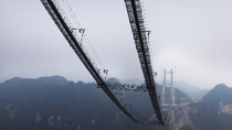 Photo taken on Oct. 20, 2010, shows the main cables of the long-span Aizhai suspension bridge in Xiangxi, central China's Hunan Province.