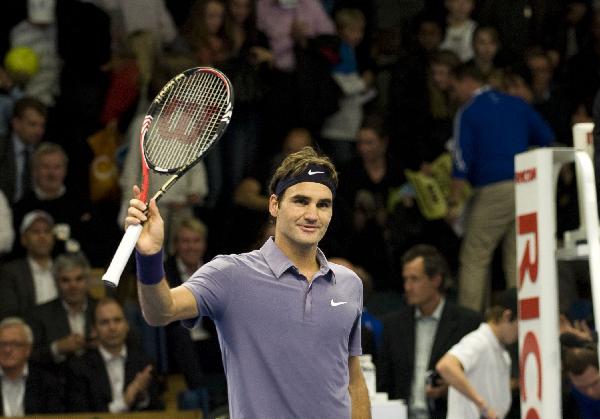 Swiss Roger Federer waves during a match against U.S. Taylor Dent in the ATP Stockholm Open tennis tournament in Stockholm, Sweden Thursday Oct. 21 2010. Federer won 2-0. (Xinhua/AFP Photo)