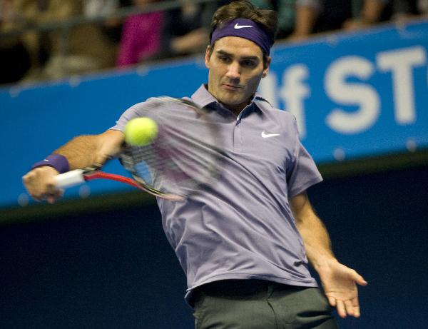 Swiss Roger Federer returns a shot to U.S. Taylor Dent during the ATP Stockholm Open tennis tournament in Stockholm, Sweden Thursday Oct. 21 2010. Federer won 2-0. (Xinhua/AFP Photo)