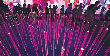 Visitors Wednesday walk past a massive digital display at the Shanghai Corporate Pavilion. A total of 67.27 million people have visited the Expo Park since the World Expo 2010 in Shanghai opened. Photo: Xinhua