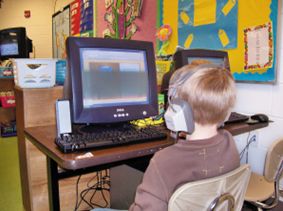 This photo shows a child surfing on the internet.