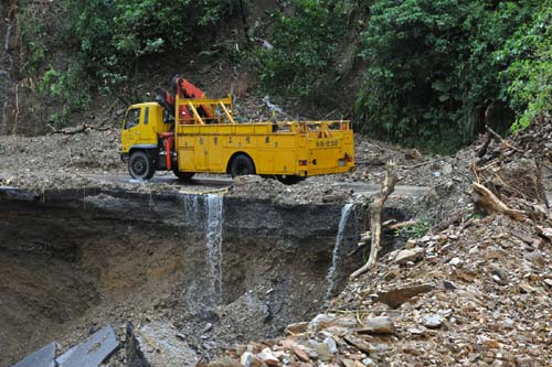 A rescue truck runs on a damaged road in Yilan county of Taiwan, Oct 22, 2010. 