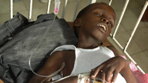 A boy suffering from cholera sleeps while waiting for medical treatment at a local hospital in the Marchand Dessaline zone, about 36 km (22 miles) from the town of Saint Marc, October 22, 2010.