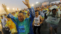 Competitors start to run in rain during the 2010 Beijing Marathon in Beijing, capital of China, Oct. 24, 2010.