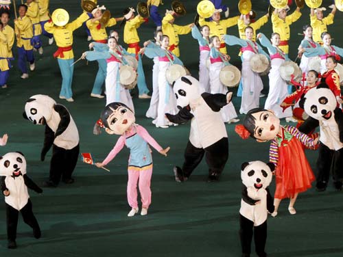 Performers dance during the 'Arirang' performance as part of celebrations to mark the 60th anniversary of the entry of the Chinese People's Volunteers (CPV) into the Korean War front in Pyongyang, Oct 23, 2010. [Photo/Xinhua] 