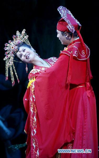 An actor and actress from the Phibada Opera Troupe perform the opera 'Liang Shanbo and Zhu Yingtai', a classical folk legend from China at Pyongyang Theatre, in Pyongyang, capital of the Democratic People's Republic of Korea (DPRK), Oct. 24, 2010. The Opera was put on show here to commemorate the 60th anniversary of the entry of the Chinese People's Volunteers (CPV) into the Korean front. [Chen Jianli/Xinhua]