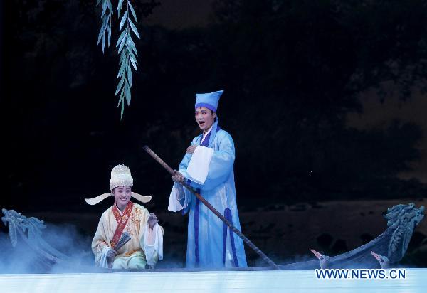 An actor and actress from the Phibada Opera Troupe perform the opera 'Liang Shanbo and Zhu Yingtai', a classical folk legend from China at Pyongyang Theatre, in Pyongyang, capital of the Democratic People's Republic of Korea (DPRK), Oct. 24, 2010. The Opera was put on show here to commemorate the 60th anniversary of the entry of the Chinese People's Volunteers (CPV) into the Korean front. [Chen Jianli/Xinhua]