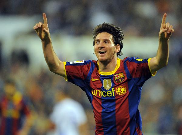 Barcelona's forward Lionel Messi celebrates after scoring against Zaragoza during their Spanish League football match Barcelona against Zaragoza at Romareda stadium in Zaragoza. Messi made it four goals in four days scoring a brace as Barcelona won 2-0 at 10-man Real Zaragoza on Saturday to replace arch rivals Real Madrid at the top of the Spanish first division. (Xinhua/AFP Photo) 