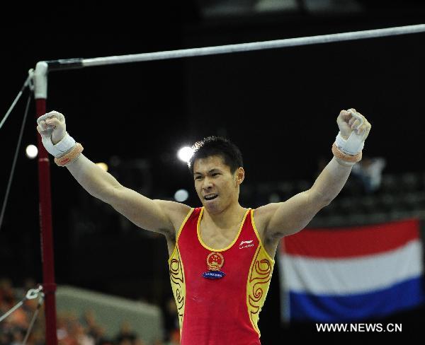 Zhang Chenglong of China celebrates after competing in the horizontal bar final at the 42nd Artistic Gymnastics World Championships in Rotterdam, the Netherlands, Oct. 24, 2010. Zhang claimed the title of the event with a result of 16.166 points. (Xinhua/Zeng Yi)