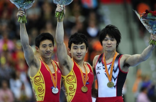 China had a successful final day of the Artistic Gymnastics World Championships on Sunday in Rotterdam. Feng Zhe (middle) won gold on parallel bars and Zhang Chenglong did the same on horizontal bar. 