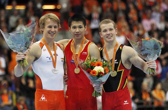 China had a successful final day of the Artistic Gymnastics World Championships on Sunday in Rotterdam. Zhang Chenglong(middle) won gold on horizontal bar. 