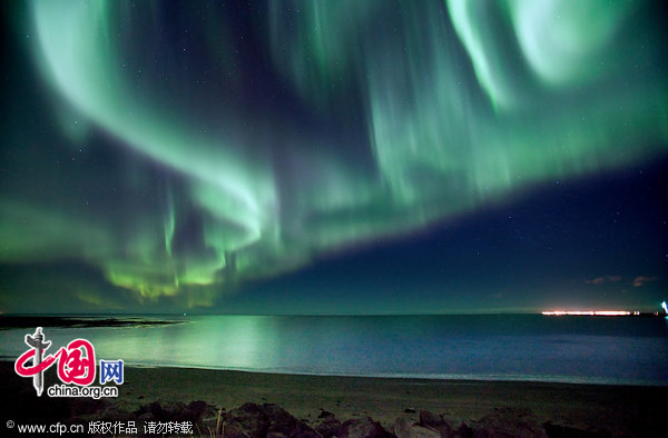 The strongest northern lights photographer Kristjan Unnar Kristjansson had ever seen, over Seltjarnarnes beach in Iceland. A 6 second exposure was used for this picture, when usually 20-30 seconds were required using the same settings.