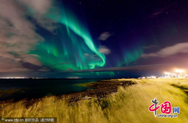 The Aurora season starts with a bang outside photographer Kristjan Unnar Kristjansson&apos;s apartment during the Autumn of 2010 in Reykjavick, Iceland. [CFP]