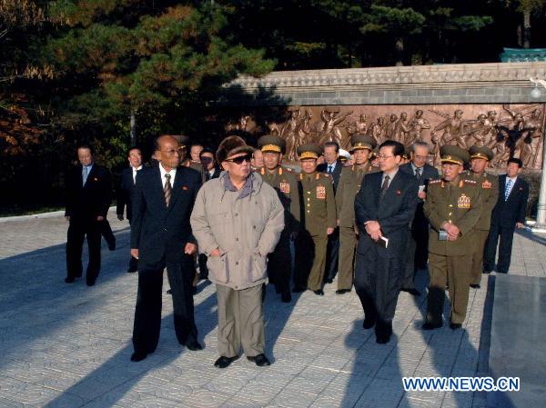Photo released by Korean Central News Agency on Oct. 26, 2010 shows Kim Jong Il (C front), top leader of the Democratic People's Republic of Korea (DPRK), attending a memorial ceremony at the tombs of the Chinese People's Volunteers (CPV) martyrs where thousands of Chinese soldiers, including late Chairman Mao Zedong's eldest son Mao Anying, were buried, in Hoechang County in South Phyongan Province as the DPRK and China marked the 60th anniversary of the entry of the CPV onto the Korean front.[Xinhua]