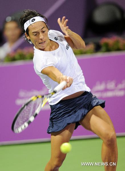 Francesca Schiavone of Italy hits a return to Samantha Stosur of Australia during the first round match of the WTA Tour Championships in Doha, Qatar, Oct. 26, 2010. Schiavone lost 0-2. (Xinhua/Chen Shaojin)