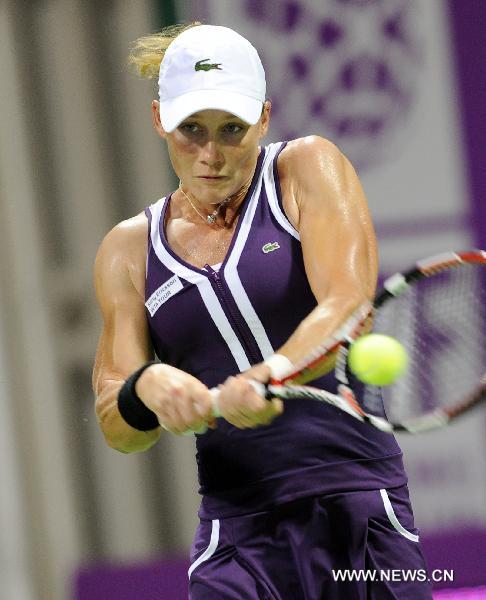 Samantha Stosur of Australia hits a return to Francesca Schiavone of Italy during the first round match of the WTA Tour Championships in Doha, Qatar, Oct. 26, 2010. Stosur won 2-0. (Xinhua/Chen Shaojin)