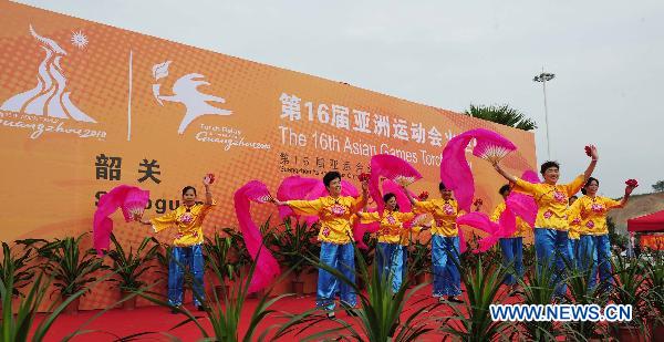 A performance is seen during the inauguration ceremony of the torch relay for the 16th Asian Games in Shaoguan City, south China's Guangdong Province, Oct. 27, 2010. (Xinhua/Liang Xu) 