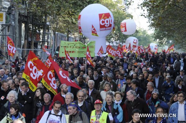 French workers take part in a demonstration against French President Nicolas Sarkozy's pension reform in Paris, France, Oct. 28, 2010. French trade unions greeted Parliament's adoption of the pension reform bill Thursday by launching a ninth wave of nationwide strikes and demonstrations. [Gonzalo Fuentes/Xinhua]