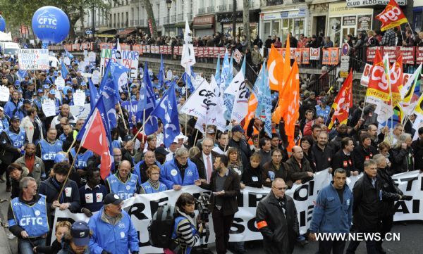 French workers take part in a demonstration against French President Nicolas Sarkozy's pension reform in Paris, France, Oct. 28, 2010. French trade unions greeted Parliament's adoption of the pension reform bill Thursday by launching a ninth wave of nationwide strikes and demonstrations. [Gonzalo Fuentes/Xinhua]