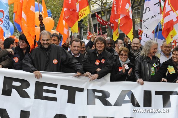 French workers take part in a demonstration against French President Nicolas Sarkozy's pension reform in Paris, France, Oct. 28, 2010. French trade unions greeted Parliament's adoption of the pension reform bill Thursday by launching a ninth wave of nationwide strikes and demonstrations.[Gonzalo Fuentes/Xinhua]