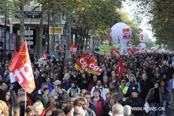 French workers take part in a demonstration against French President Nicolas Sarkozy's pension reform in Paris, France, Oct. 28, 2010. French trade unions greeted Parliament's adoption of the pension reform bill Thursday by launching a ninth wave of nationwide strikes and demonstrations. [Gonzalo Fuentes/Xinhua]