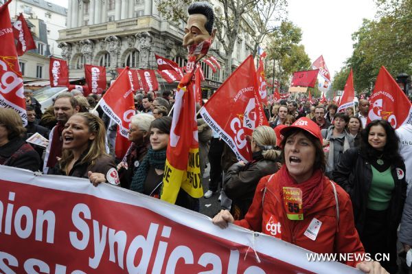 French workers take part in a demonstration against French President Nicolas Sarkozy's pension reform in Paris, France, Oct. 28, 2010. French trade unions greeted Parliament's adoption of the pension reform bill Thursday by launching a ninth wave of nationwide strikes and demonstrations. (Xinhua/Gonzalo Fuentes) (gj) 