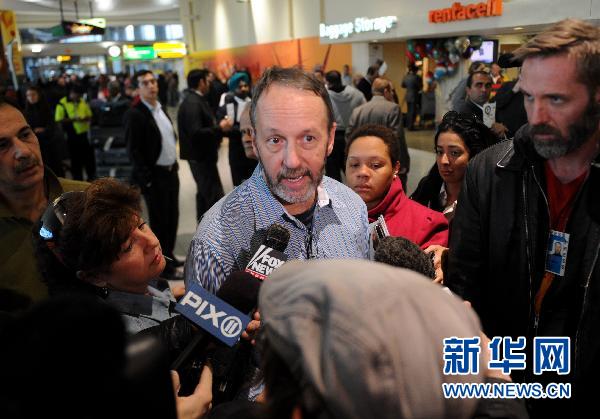 Louis Kelley, a passenger of Emirates Airlines flight 201 talks to journalists after arriving at the JFK airport in New York on October 29, 2010. The plan has been escorted by two F-16s since it entered U.S. airspace. The U.S. officials said there is no known threat associated with the plane, but it was escorted to John F. Kennedy International Airport as a precautionary move. [Xinhua] 