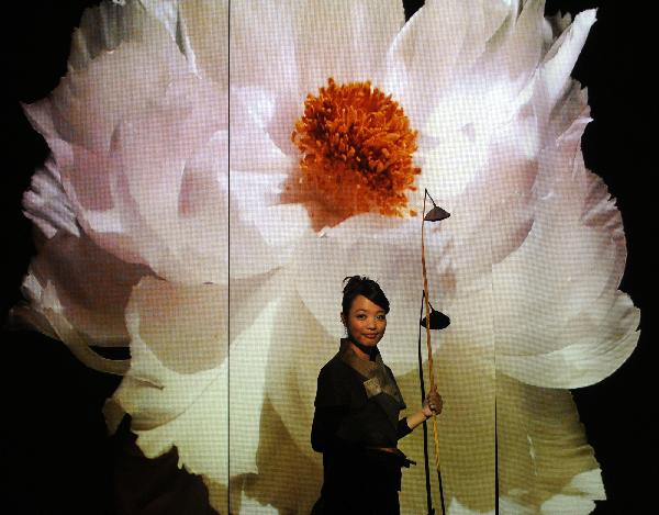 A woman visits the Pavilion of Angel Life during an activity held by the 2010 Taipei International Flora Expo in Taipei, southeast China's Taiwan, Oct. 30, 2010. The 2010 Taipei International Flora Expo will run from Nov. 6, 2010 to April 25, 2011. [Xinhua/Wu Ching-teng]