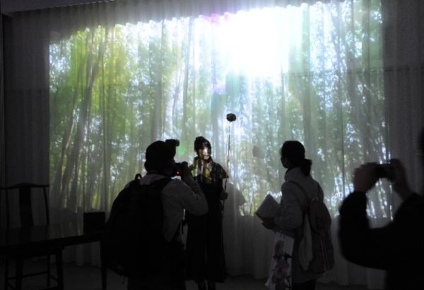 People visit the Pavilion of Angel Life during an activity held by the 2010 Taipei International Flora Expo in Taipei, southeast China's Taiwan, Oct. 30, 2010. The 2010 Taipei International Flora Expo will run from Nov. 6, 2010 to April 25, 2011. [Xinhua/Wu Ching-teng]