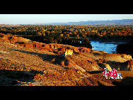 The World Heritage Committee decided to include China Danxia Landform in the World Heritage List at its 34th meeting being held in Brasilia, capital of Brazil, on Aug.1, 2010.  Photo shows the intoxicating Danxia Landform scenery in northwest China's Xinjiang Uygur Autonomous Region. [Photo by Wu Changqing]