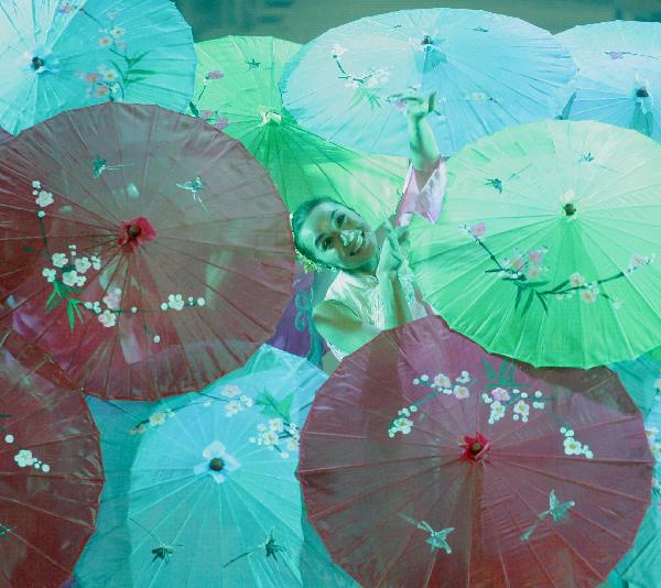 Performers from China's Sichuan Nationality Song and Dance Troupe perform Lane in Rain at the Manhattan Center in New York, the United States, Oct. 31, 2010. The performance is a part of series activities of 'Cultural China --Splendid Sichuan'. [Xinhua photo] 