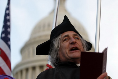 Tea Party Patriots supporter James Manship, whose nickname is States, reads from the Declaration of Independence during a Flag Ceremony at the US Capitol in Washington, November 2, 2010. [China Daily/Agencies] 
