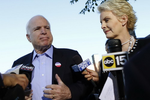 US Senator John McCain (R-AZ) and his wife Cindy McCain speak to reporters outside a polling place in the Phoenix, Arizona November 2, 2010. McCain is seeking a fifth term will challenge Democratic candidate Rodney Glassman in the Senate race. [China Daily/Agencies] 