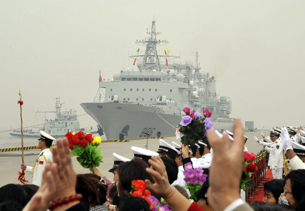 People wave goodbye to soldiers on the Chinese naval escort vessels in Zhoushan, East China&apos;s Zhejiang province, Nov 2, 2010. The vessels are part of China&apos;s seventh naval escort flotilla headed for the Gulf of Aden and Somali waters. [Xinhua]