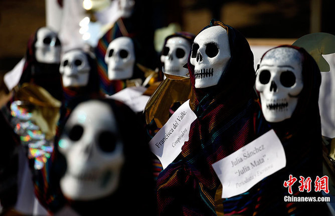 People dressed as a skeleton during &apos;Day of the Dead&apos; in Mexico, Nov. 2, 2010.