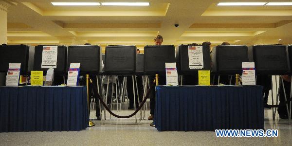 Voters cast their ballots during the midterm elections at a polling station in the City Hall of San Francisco, the United States, Nov. 2, 2010. [Liu Yilin/Xinhua]