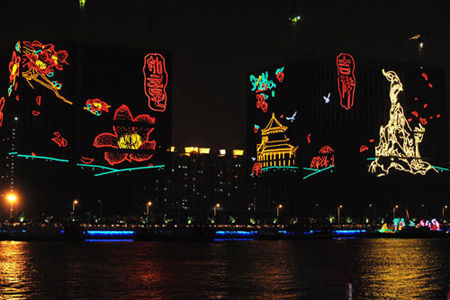 The south bank of Pearl River is lit up by neon lights on Oct 20, 2010. (Photo/Xinhua) 