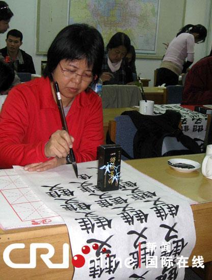 A Thai student practices to write Chinese characters in mid October 2010. 